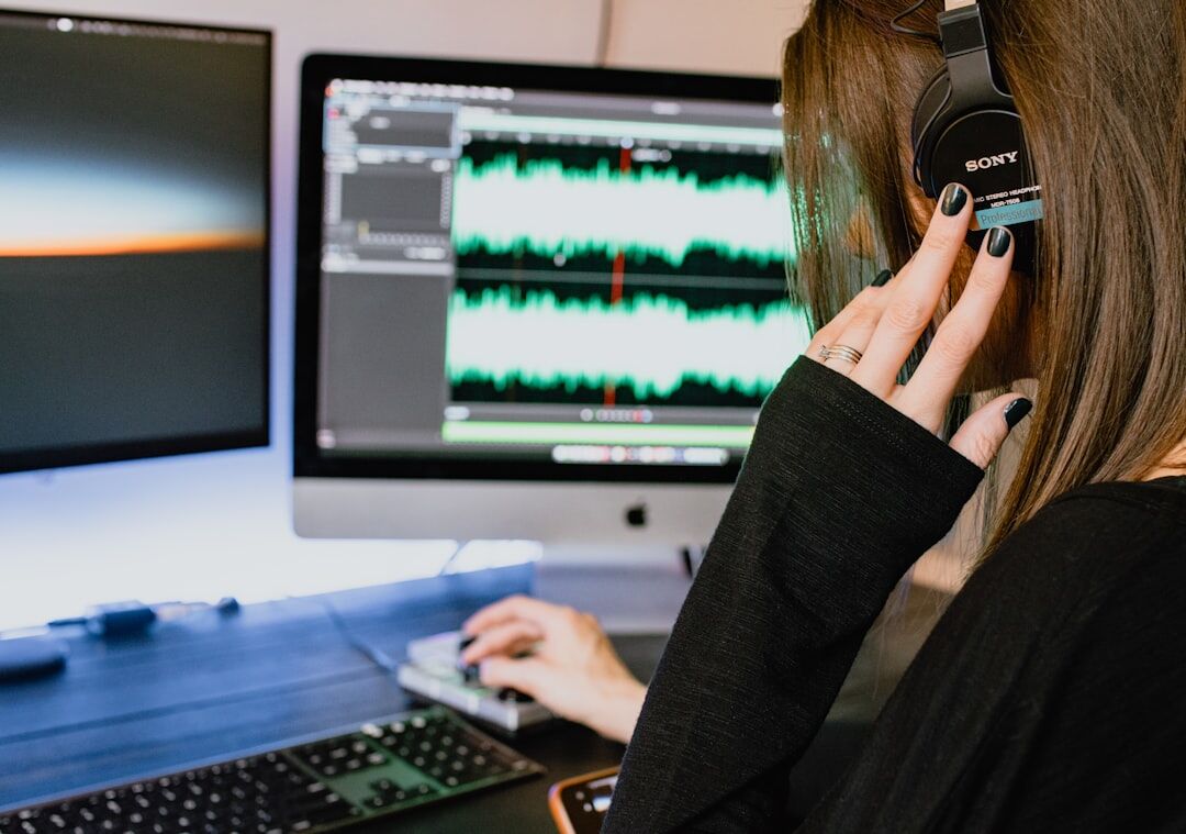 Broadcaster recording podcast in professional studio with headphones